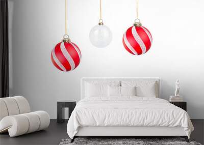 three Christmas ornaments hanging on a transparent background Wall mural