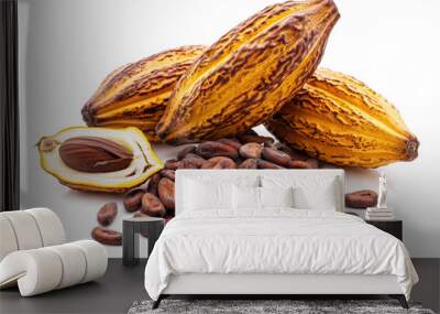 A close up of two chocolate pods with a pile of chocolate beans on top. The beans are scattered around the pods, creating a sense of abundance and richness. The image evokes a feeling of indulgence Wall mural