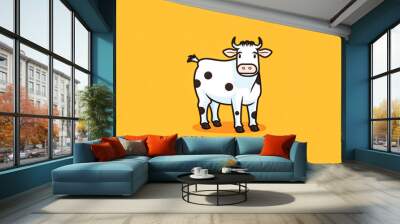 Cartoon cow with white face and black spots stands in front of orange background. Wall mural