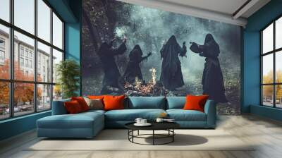 Four people dressed in black robes are gathered around a fire in a forest. They are holding candles and appear to be performing a ritual. Scene is mysterious and eerie Wall mural