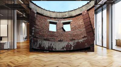 abandoned brick building with a tower with the broken empty Windows Wall mural