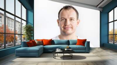 Closeup portrait of serious 30 years old caucasian white man on white background in white t-shirt. Confident happy smart modern man looking in camera. Lifestyle Wall mural