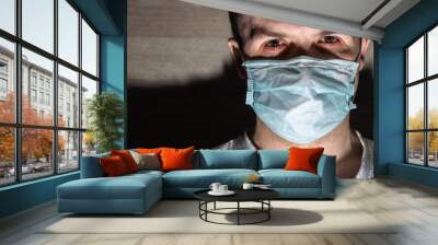 sick man in a medical mask, protection against viruses and bacteria Wall mural