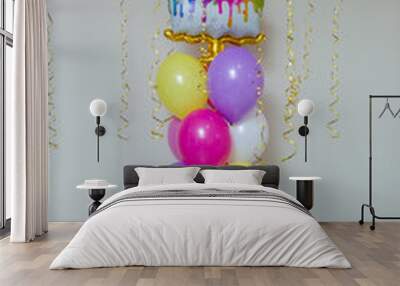 a bunch of bright balloons, a cake-shaped balloon Wall mural