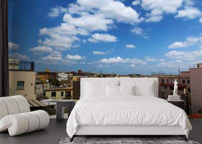 Panoramic city view in Italy, sky with clouds Wall mural