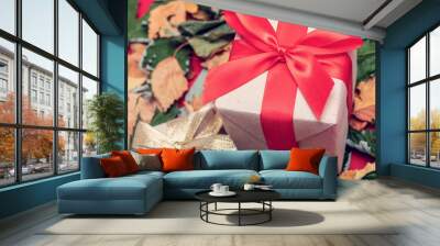 Fallen leaves, two gifts, closeup, top view Wall mural