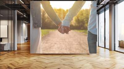 a young couple spends time together outdoors. couple having fun summer time Wall mural