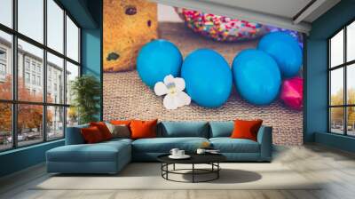 Easter eggs with Easter and flowers close-up. Wall mural