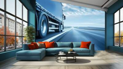 A semi truck drives along a highway with an open horizon and blue sky, showcasing a sense of vastness and freedom. Generative AI Wall mural