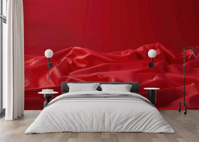 Smooth red fabric draping elegantly on a surface in soft lighting Wall mural