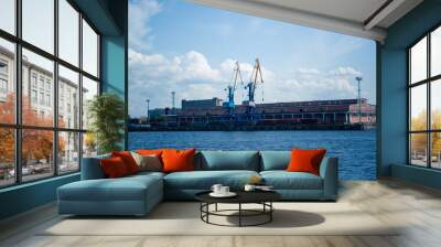 cargo port cranes against blue sky Wall mural