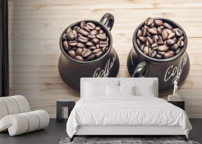 two toned cups with coffee grains on wooden plank background for two Wall mural