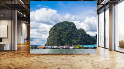 View of the Gypsy village on the water against the background of mountains and skies with clouds. Adaman Sea. Thailand. Wall mural