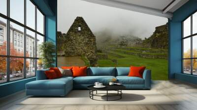 Ruins of the ancient Inca city machu picchu in fog, Peru Wall mural