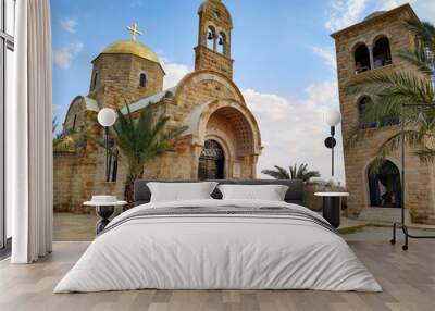 View of St. John the Baptist Greek Orthodox Church, located at the site of the baptism of Jesus Christ on the Jordan River. Blue sky with some clouds. Wall mural