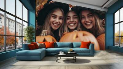 Girls Celebrating Halloween with Pumpkins and Costumes Wall mural