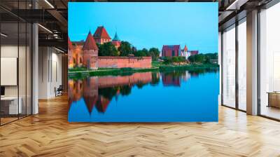 Marienburg castle the largest medieval brick castle in the world in the city of Malbork evening view at night Wall mural