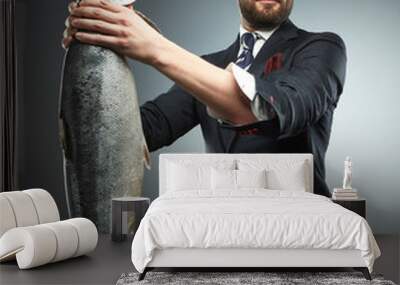 A man in a business suit with fresh salmon i Wall mural