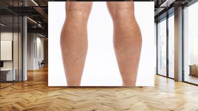 Bare hairy male legs on a white background. Close-up. Wall mural