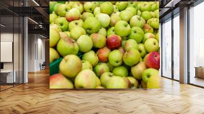 Lots of seasonal green apples on the counter. Healthy eating and vegetarianism. Wall mural