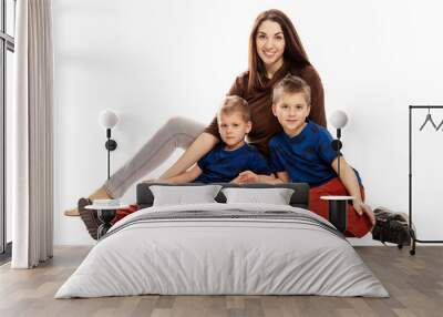 Mom and sons hug and smile. Tenderness and love. Isolated on a white background. Wall mural