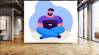 A bearded freelance man sits on floor with a laptop on his lap. The student chooses a distance learning course. Work from home during quarantine. Vector flat business illustration of flowing shapes. Wall mural