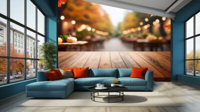 Empty wooden tabletop over blurred autumn background Wall mural