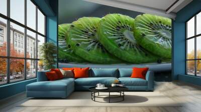 Juicy kiwi slices on a plate, 4K hyperrealistic photo Wall mural