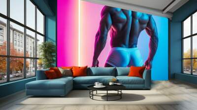 A back view of a muscular fitness male model wearing underwear on a colored background Wall mural