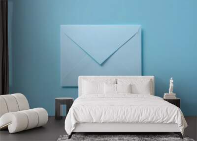 An envelope with blue ink, a letter on white paper, a flat lay design, and corporate identity Wall mural