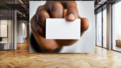 Blank business card in hand, isolated on white Wall mural