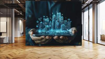 Businessman holding smart city hologram and digital interface in a collage Wall mural