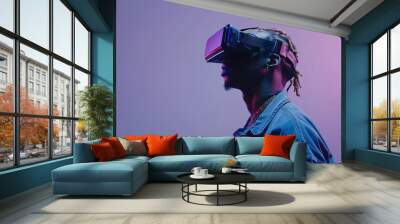 Handsome man using smart VR glasses on blue background, using Hi Tech smart VR glasses. Virtual Reality, future, gadgets, technology, video games concept. Wall mural