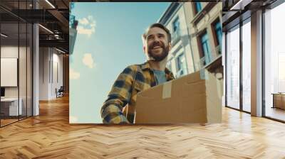 Man moves into his new apartment, dances excitedly. Guy purchased a new home and is ready to unpack the boxes. Wall mural