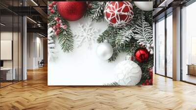 On a white wooden background, there is a border of shiny white and red balls, evergreen branches and a New Year's card. Wall mural