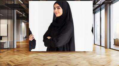 Stylish Muslim models on transparent background, smiling Arab women wearing black hijabs standing arms crossed Wall mural