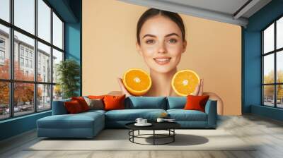 The effects of vitamin C on skin. Happy woman with organic slices of citrus fruits, dermatology or healthy wellness health. Wall mural