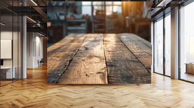 This photo features a worn old wooden table and the interior of a workshop. Sunlight and shadows are present in the background as well. Wall mural