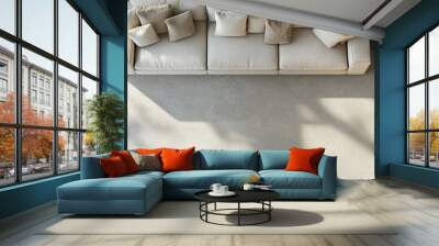 Top view of a cozy living room with a sectional sofa and modern furniture, with natural light behind it. Wall mural