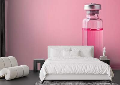 Using a glass bottle filled with pink liquid to administer vitamin B12 injections Wall mural