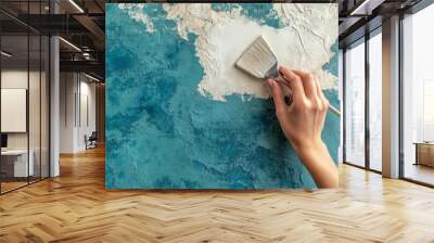 Using a trowel or spatula, a woman removes old vinyl wallpaper Wall mural