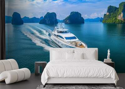 Yachts cruising on the sea with lush greenery behind them depict a luxurious vacation or trip. Stock image Wall mural