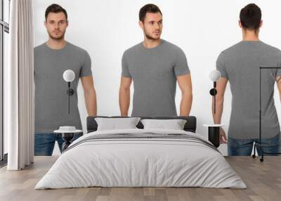 A handsome muscular guy in a grey t shirt. Mockup of a template of a grey man's t-shirt on a white background. Front view, rear view.  Wall mural