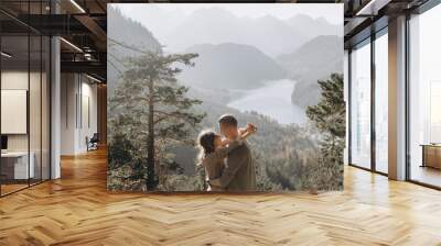 man and woman looking at mountains Wall mural