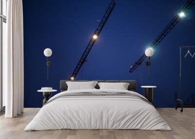 construction cranes with lights on Wall mural