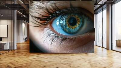 a child's eye through a magnifying glass close-up. Wall mural