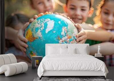 children hold a globe on the background of nature. selective focus Wall mural