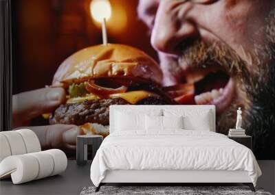 close-up of a man eating a burger. Selective focus Wall mural