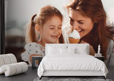 happy mother with daughter eating ice cream in the park in summer. Wall mural