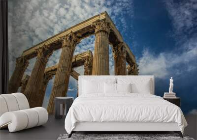 ancient marble column of old temple in outdoor museum place on blue sky background  Wall mural